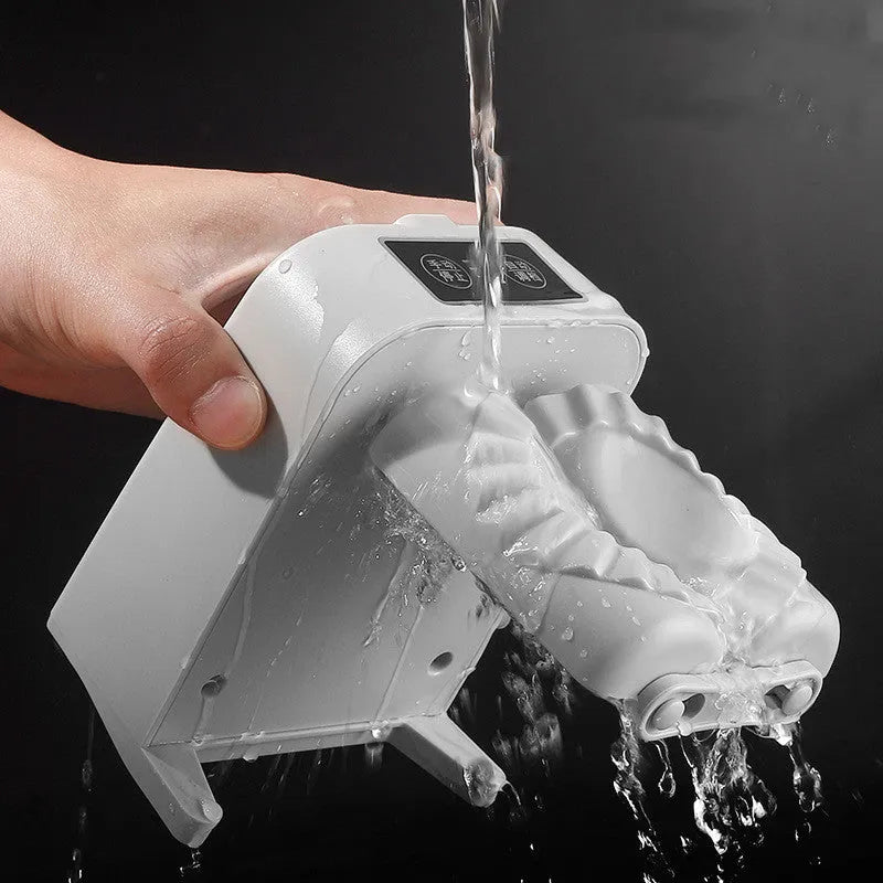 White electric dumpling maker machine with USB charging cable and accessories on kitchen counter