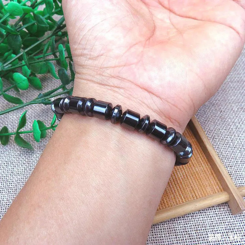 Black stretch bracelet with pentagram stone design, made from magnetite and hematite.