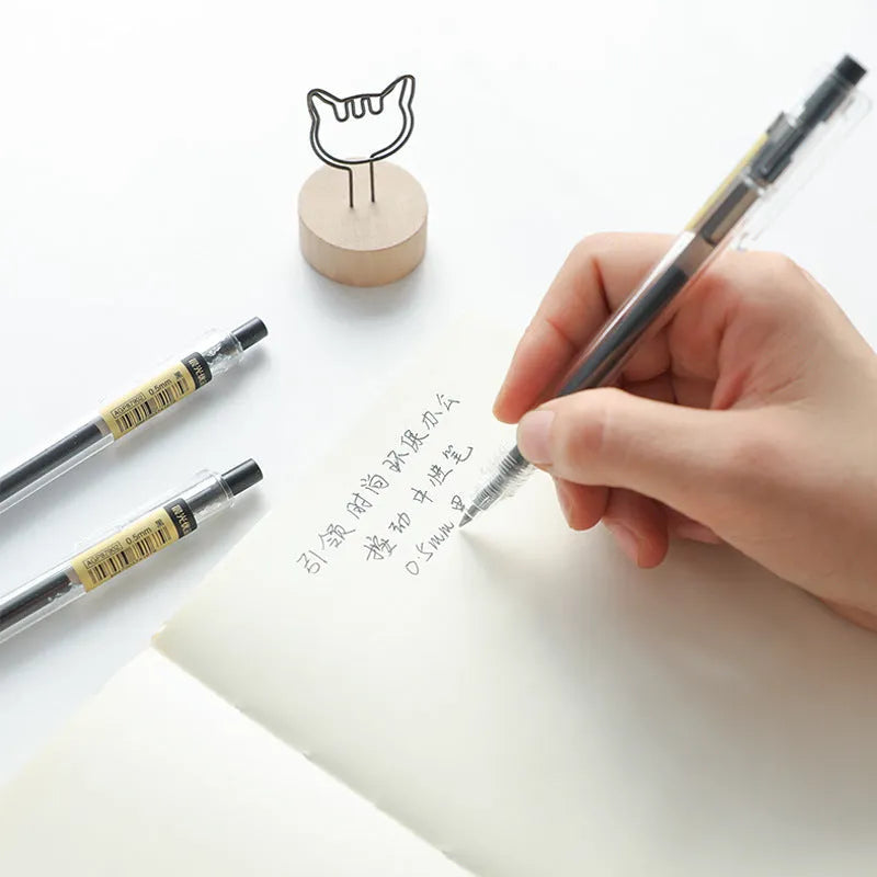 Set of twelve black frosted gel pens with retractable design and 0.5mm tips alongside two spare refills