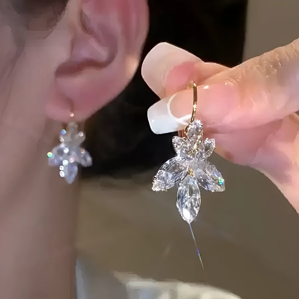 Platinum colour leaf earrings with shiny inlaid zircon stones