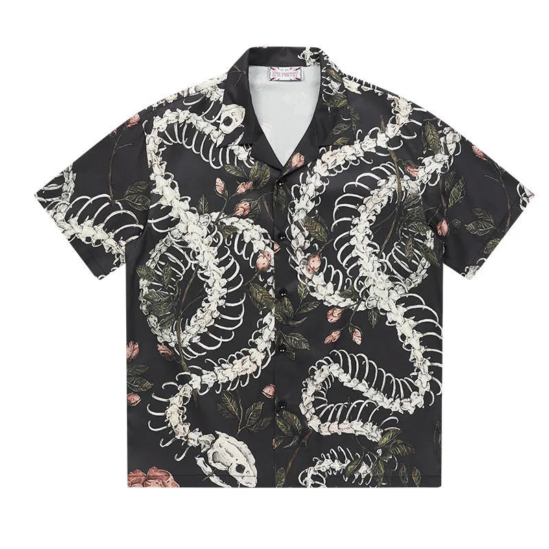 Short sleeve loose fit Cuban collar shirt with a printed snake bone pattern design in a colour option.