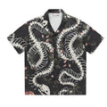 Short sleeve loose fit Cuban collar shirt with a printed snake bone pattern design in a colour option.