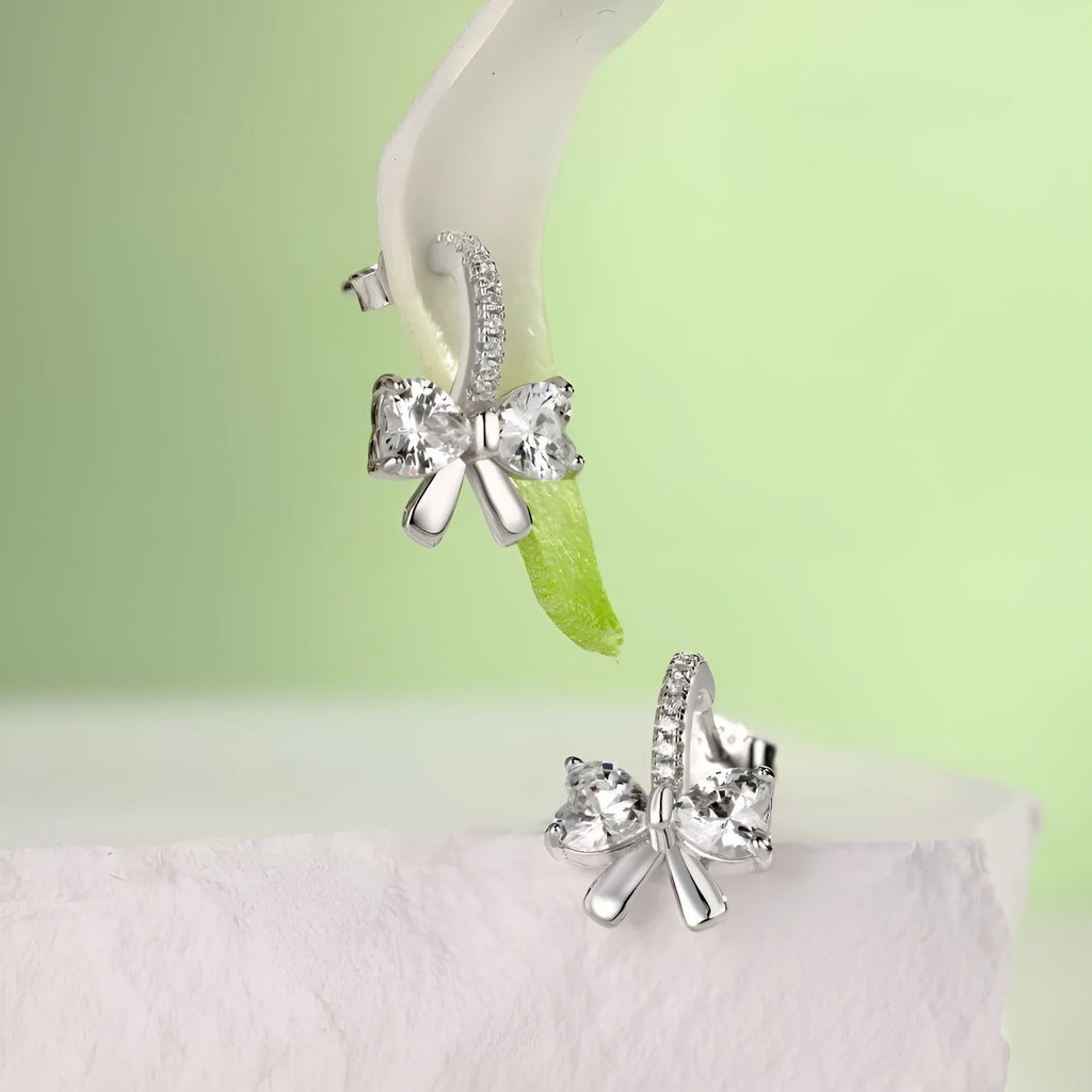 925 silver bowknot ear studs electroplated platinum finish on white background