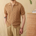 Light brown short sleeve cotton cardigan with a front zipper and lapel collar laid flat.