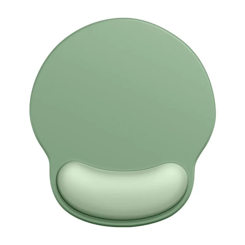 Silicone mouse mat with wrist support in a gradient blue colour on a desk.