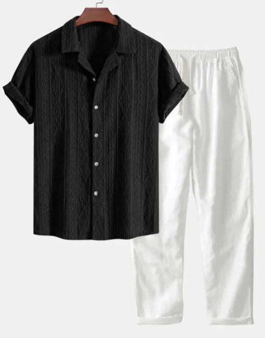 Casual linen suit set with camouflage print, featuring a short-sleeved top and matching trousers.