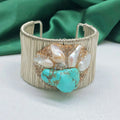 Silver coloured women's bracelet with pearl material and diamond inlay in original baroque design