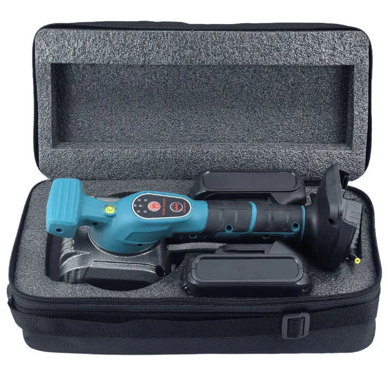 Household electric ceramic tile tiling machine with lithium battery and two batteries on work surface