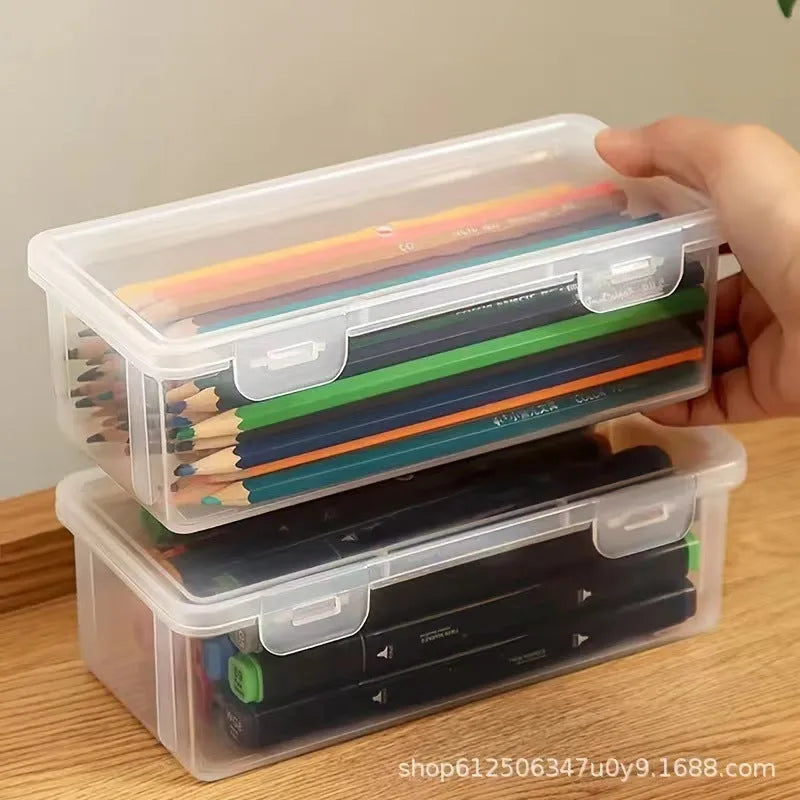 Large transparent plastic stationery storage box holding coloured pencils and crayons.