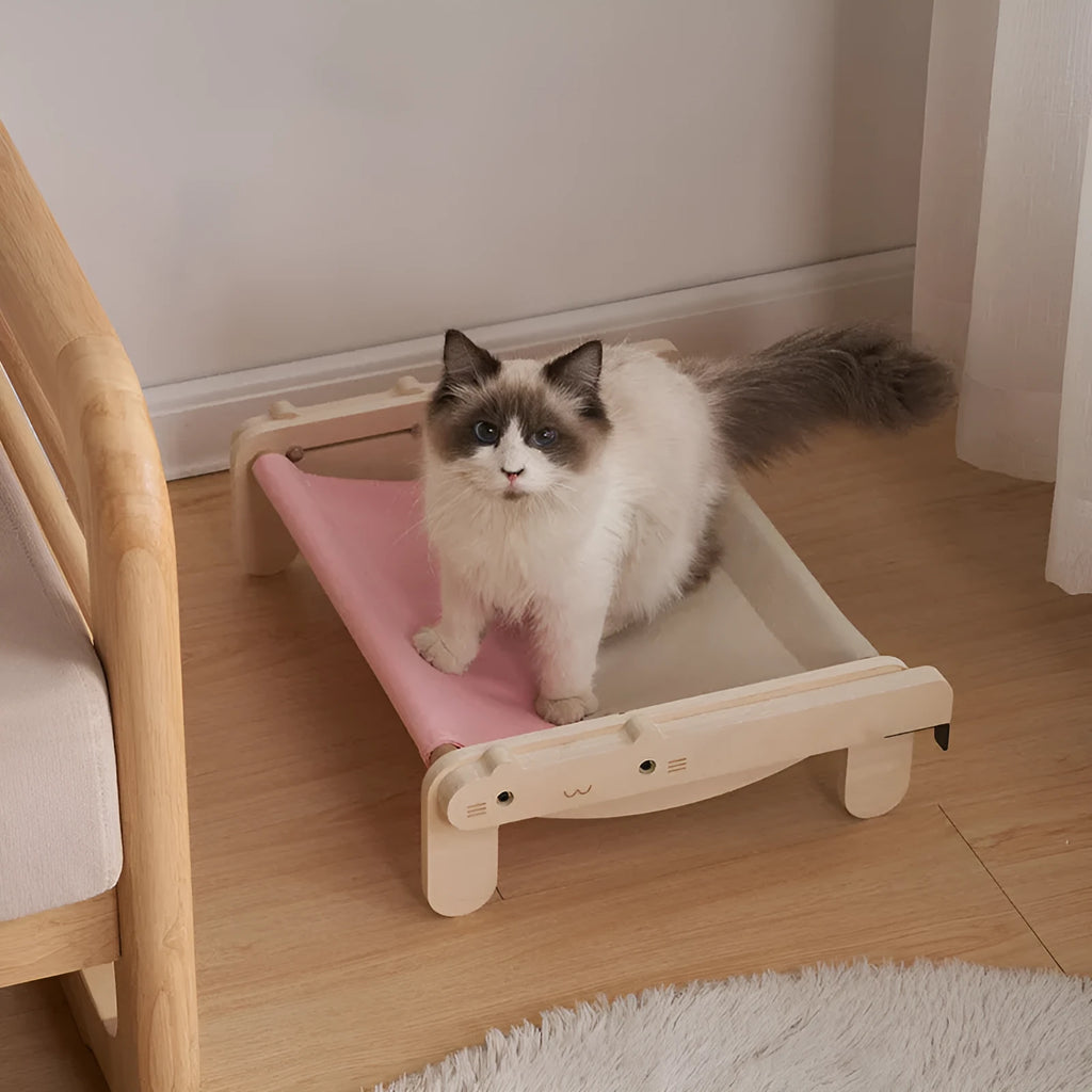 Solid wood cat bed with washable cover in grey-blue colour option on floor