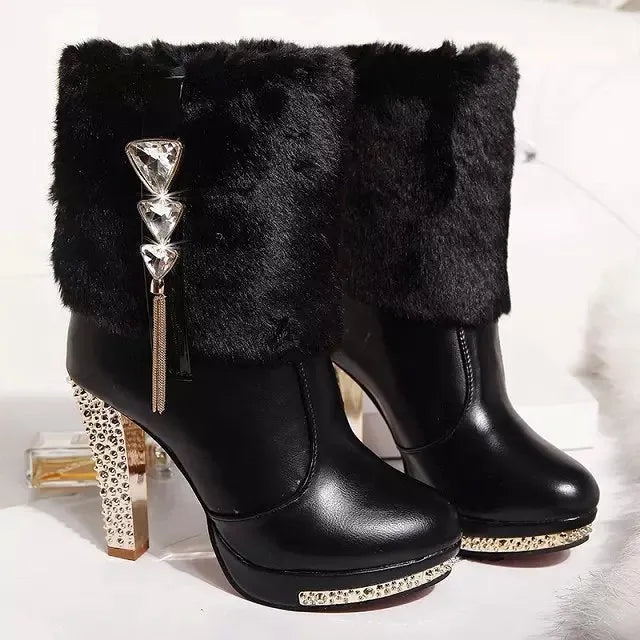 Women's black ankle boots with a chunky high heel on a white background.