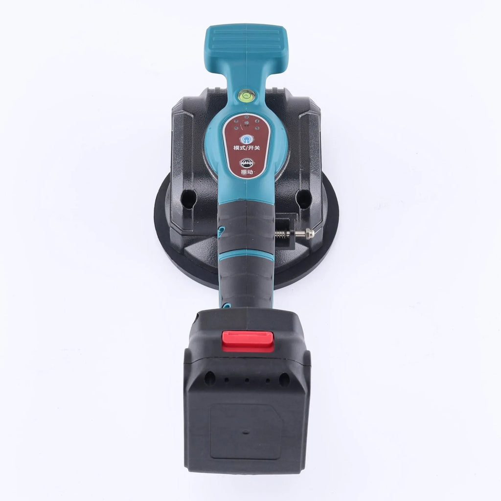 Household electric ceramic tile tiling machine with lithium battery and two batteries on work surface
