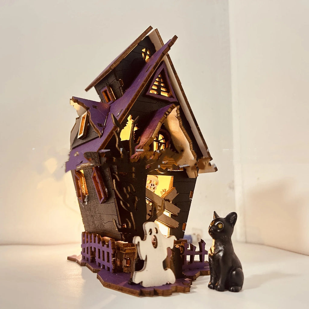 DIY wooden glowing haunted house Halloween table decoration and candlestick holder.