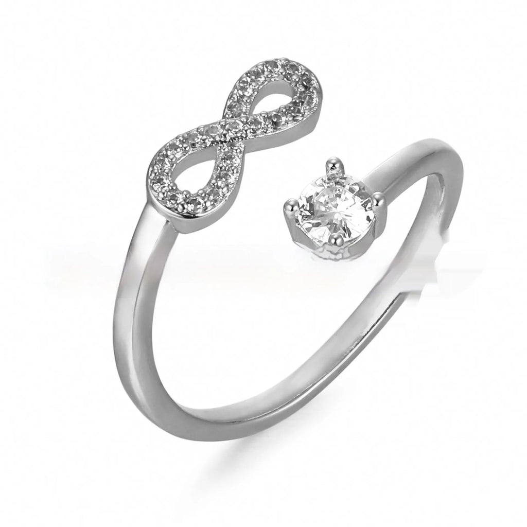 Geometric open zircon letter ring in gold on a hand, showing the detailed character design.