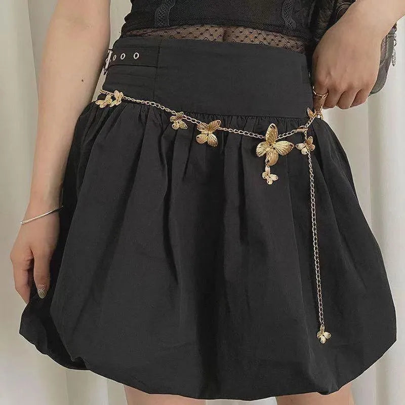 Gold butterfly waist chain for women, 104cm long and 40mm wide, shown laid flat.