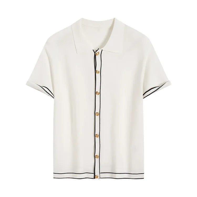 White short-sleeve women's V-neck cardigan with dark contrasting lapels laid flat.