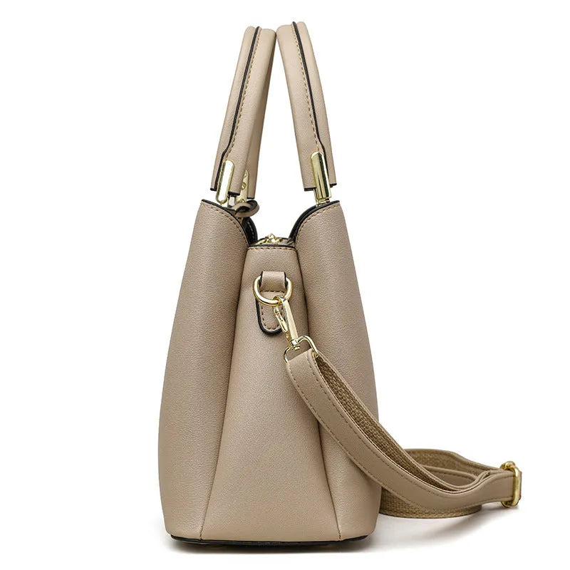 Women's black PU leather messenger bag with shoulder strap and sewing thread detail.