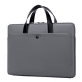 Ultra-thin leather laptop case in light grey with zipper closure and soft handle for 14 inch devices