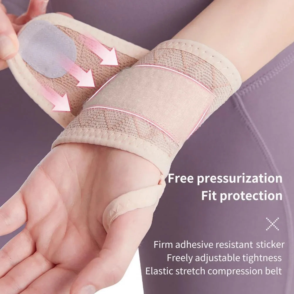Black adjustable wrist brace for carpal tunnel support with hook-and-loop strap on hand