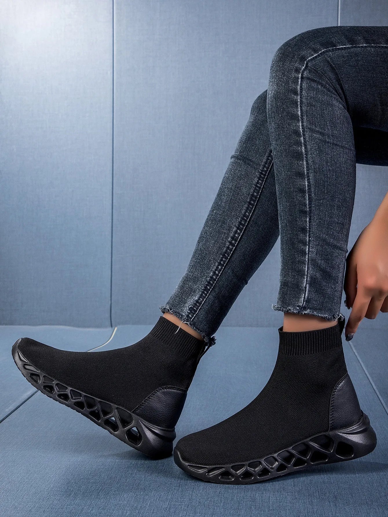 Women's black breathable mesh high-top casual sock boots with flat MD sole on a white background.