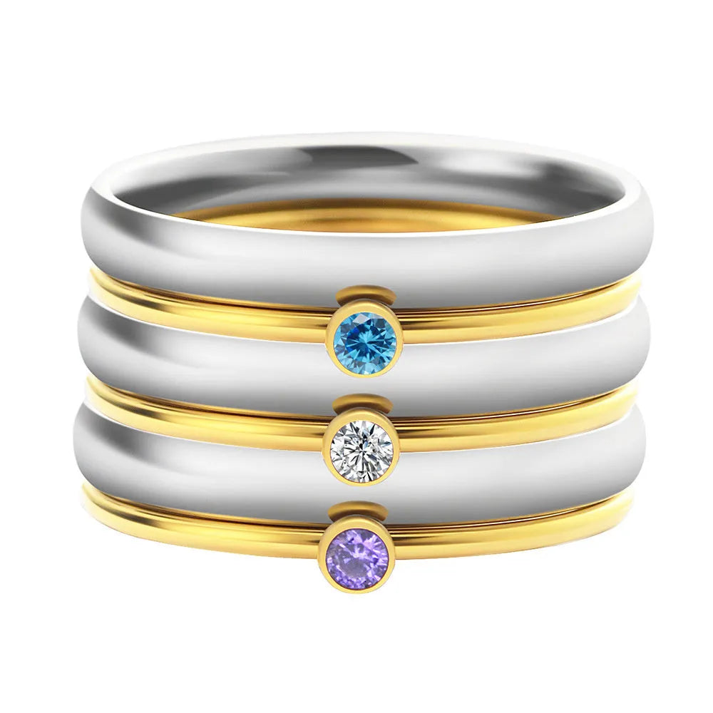 December colour birthstone engraved geometric ring in gold-tone titanium steel.