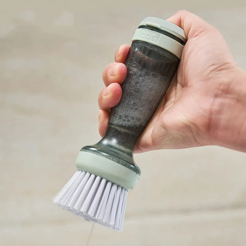 Pot and dish brush with integrated soap dispenser and replaceable brush head in mint green