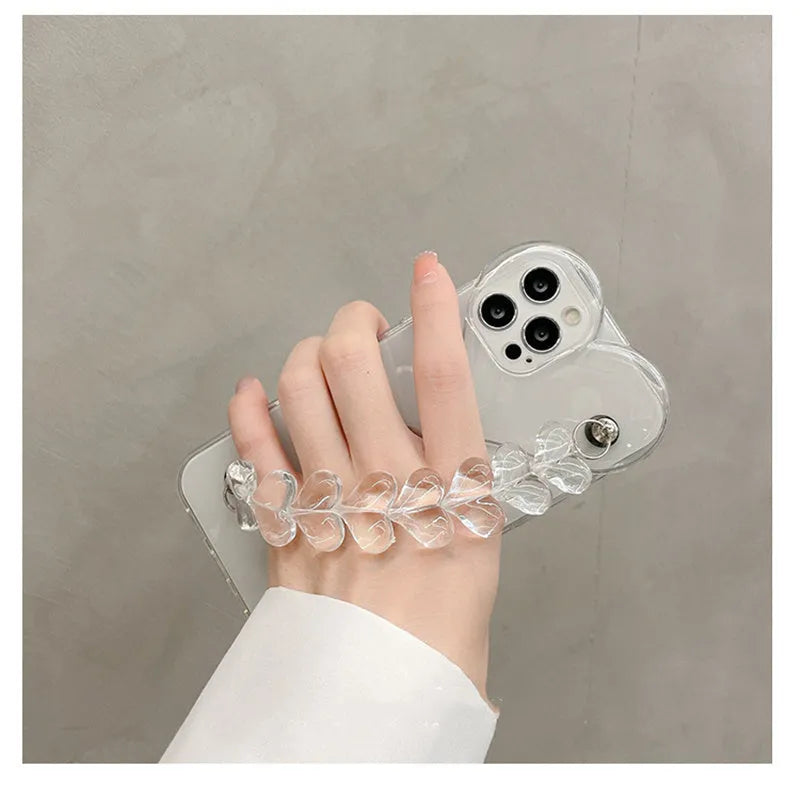 Transparent clear iPhone case with a love heart chain design on a smartphone.