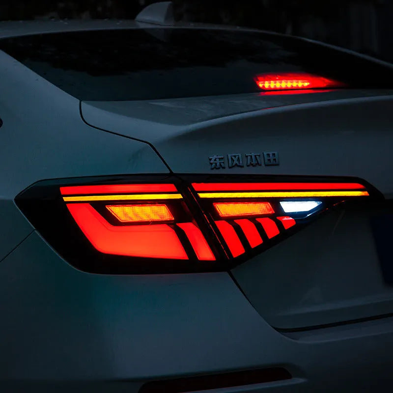 11th Generation Honda Civic modified LED taillight assembly with sequential streamer turn signals in black and red finish.