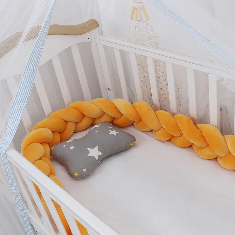 Spandex crystal velvet baby cot bumper in grey pink colour, shown flexible and long.