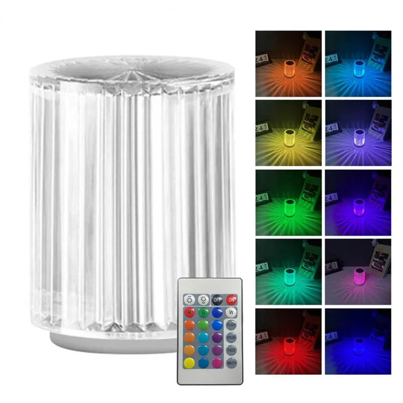 Compact acrylic crystal LED table lamp with RGB colours and remote control on a desk