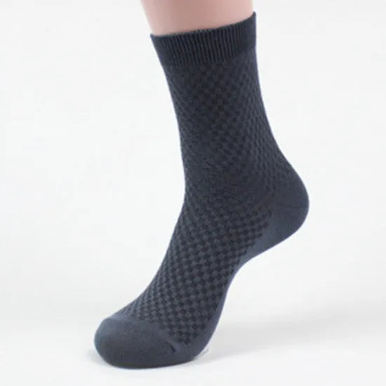 Pair of men's bamboo fibre business socks with small square pattern, shown in navy blue.