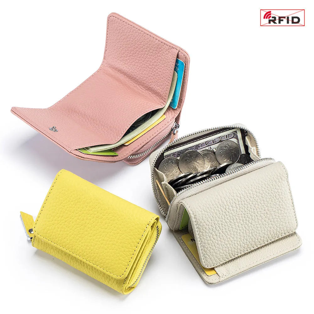 Women's leather tri-fold mini RFID wallet in elephant gray, 10x4x7.5cm, with sewing thread detailing