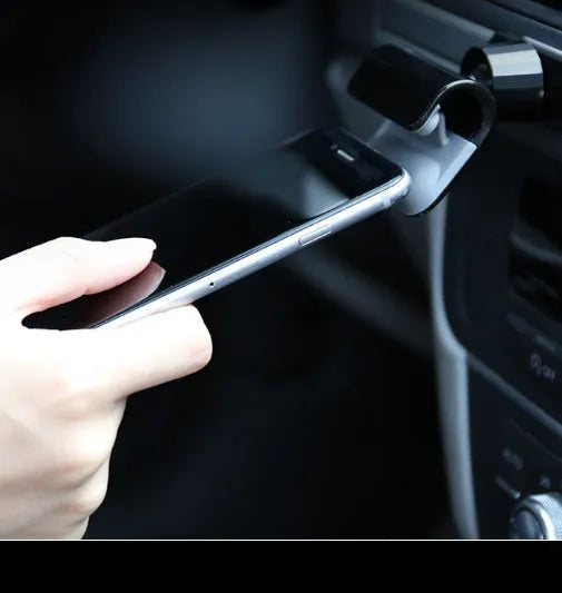 Black 360-degree rotatable car phone holder showing gravity pivot and adhesive mounting for 4-7 inch mobile phones