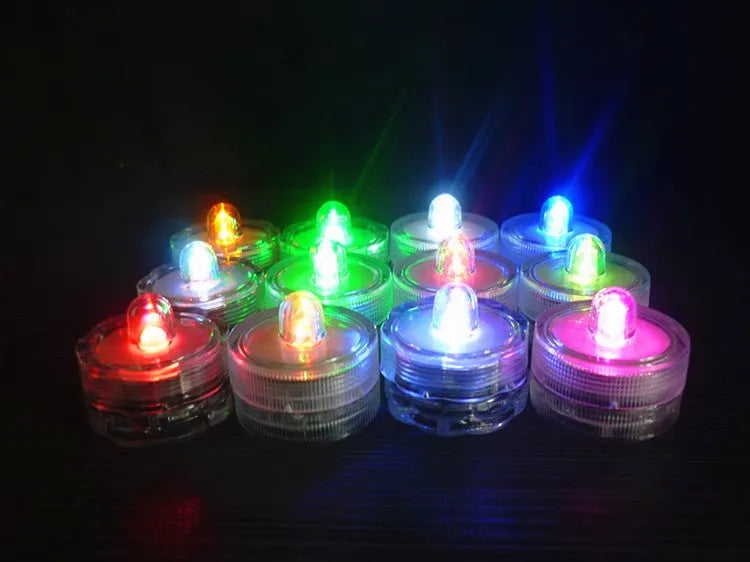 LED waterproof electronic candle light in seven colours, 3cm diameter, 2.6cm height, plastic body, 12-pack