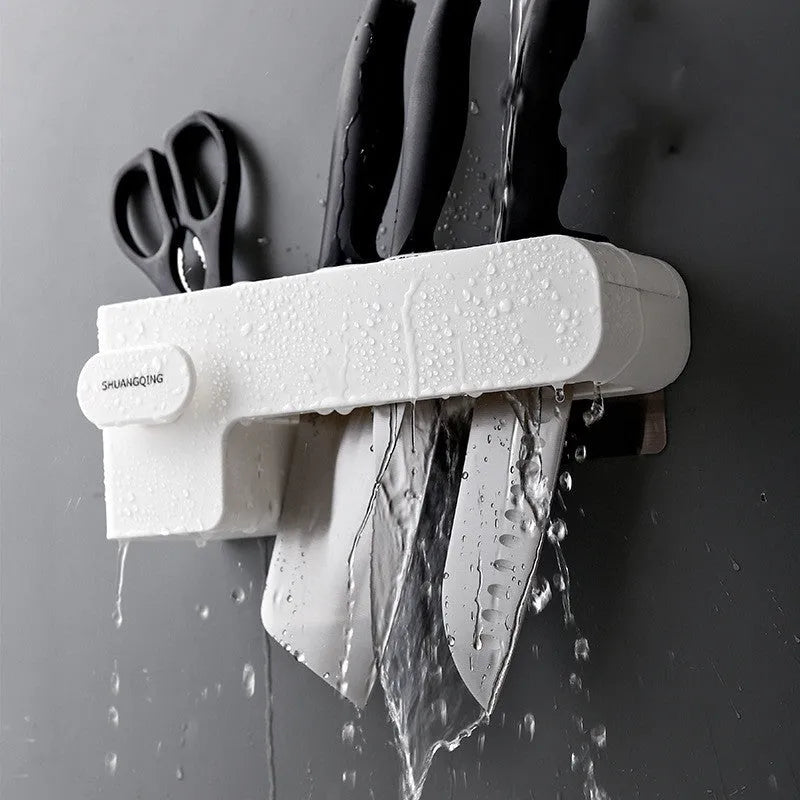 White plastic kitchen knife rack on countertop with dimensions 26 cm height