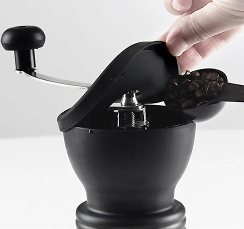 Manual hand coffee grinder with black format, beech wood body, 88 mm width and 160 mm height, front drawer for ground coffee