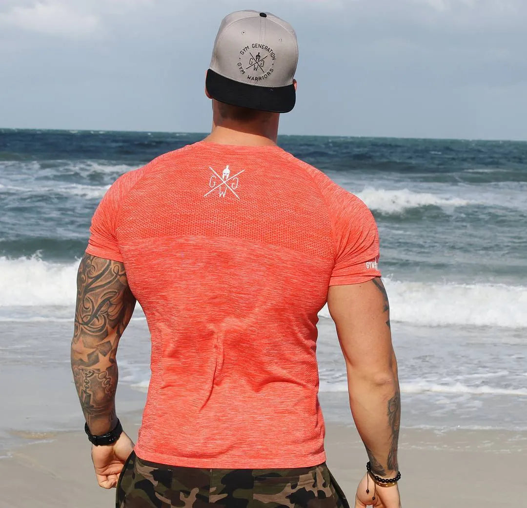 Short sleeve polyester workout top in orange, blue, grey, or light grey, sizes M to XXXL with size chart.