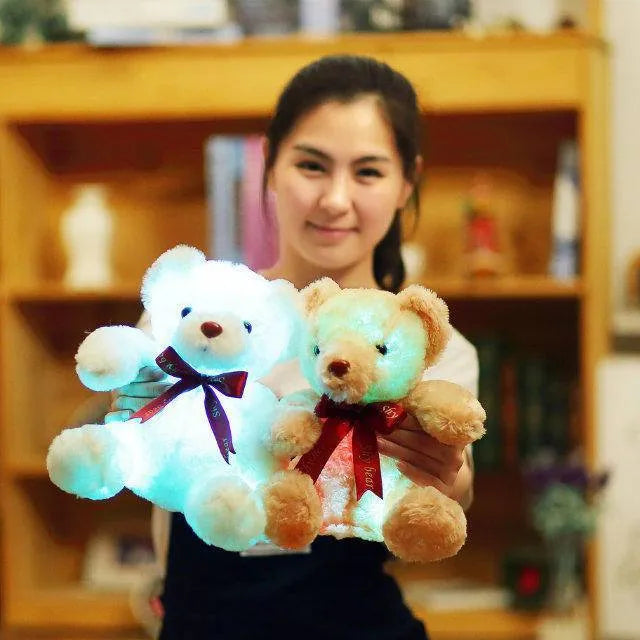 Plush teddy bear with glow feature in brown colour, sitting at 25 cm height