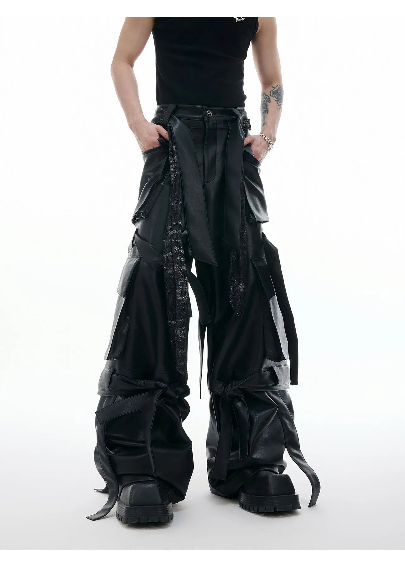 Black quilted loose-fit trousers with multiple pockets and leather-like appearance