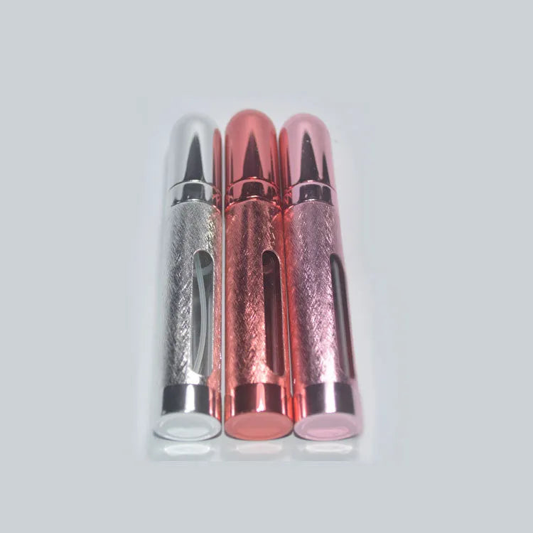 Slim 12ml aluminium travel perfume bottle with glass liner in blue, gold, pink, red, silver, and violet colours.