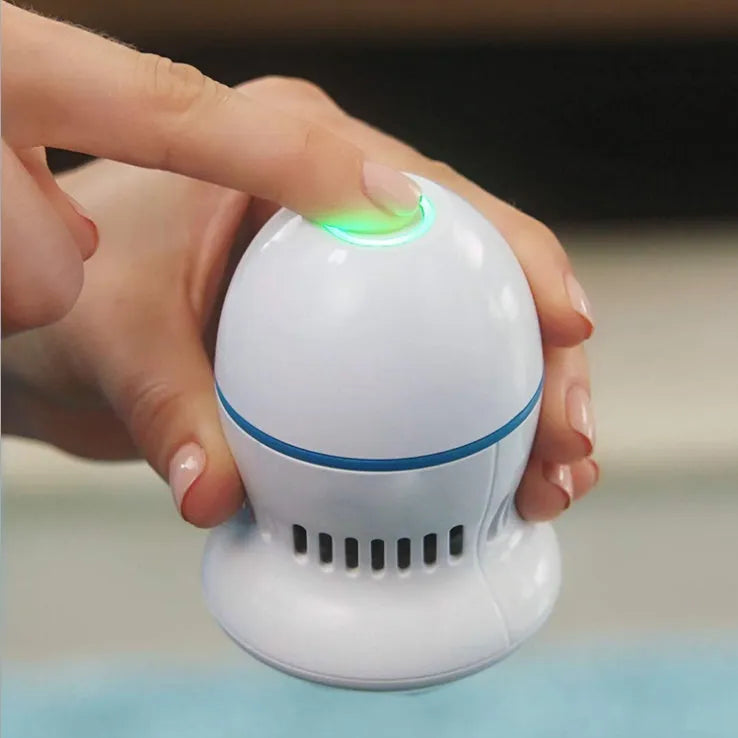 Beige and white electric foot file grinder with USB cable and grinding heads
