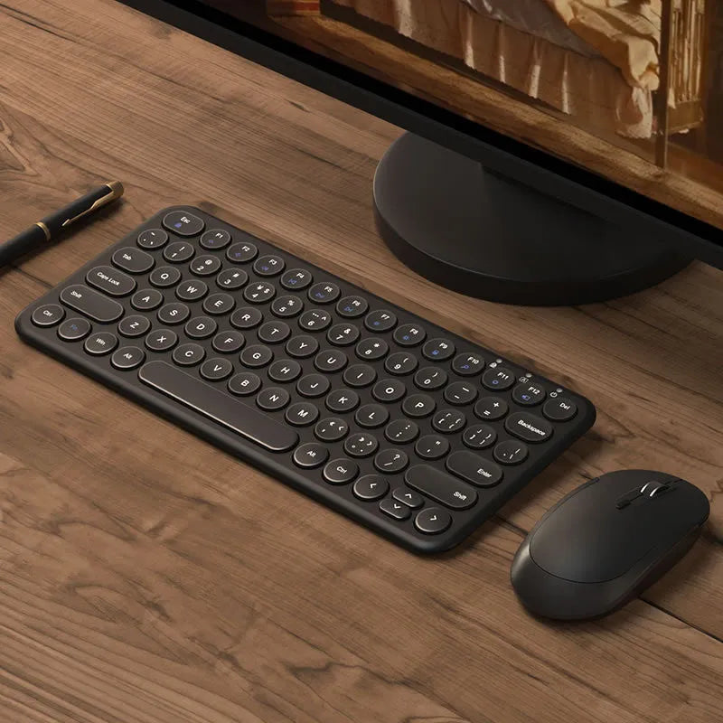 White ultra-thin wireless keyboard and mouse set on a desk, showing USB receivers and keyboard film.