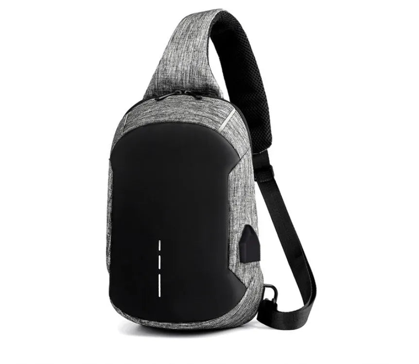 Small dark blue oxford cloth chest bag with a zipper and adjustable strap, showing internal phone pocket.