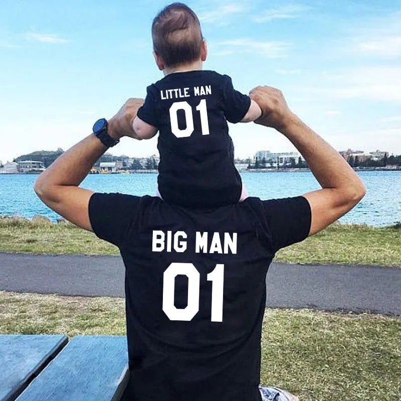 Parent and child wearing matching solid colour cotton T-shirts in black and white