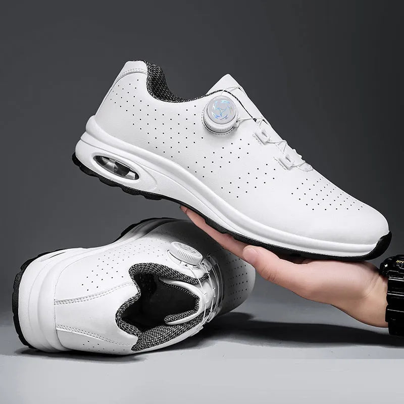 Pair of black low-top mesh tennis shoes with cross shoulder straps and white laces.