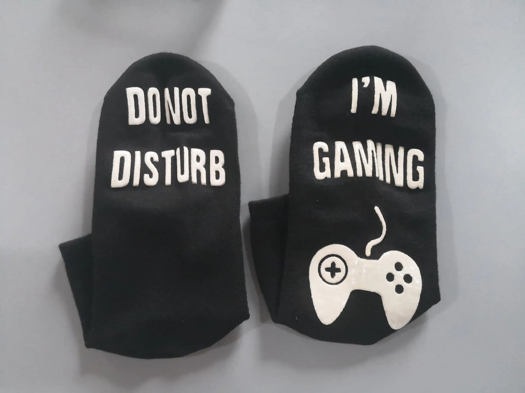 Cotton dispensing socks with 3D letter print, shown in black, blue, and white, with short, medium, and long tube lengths