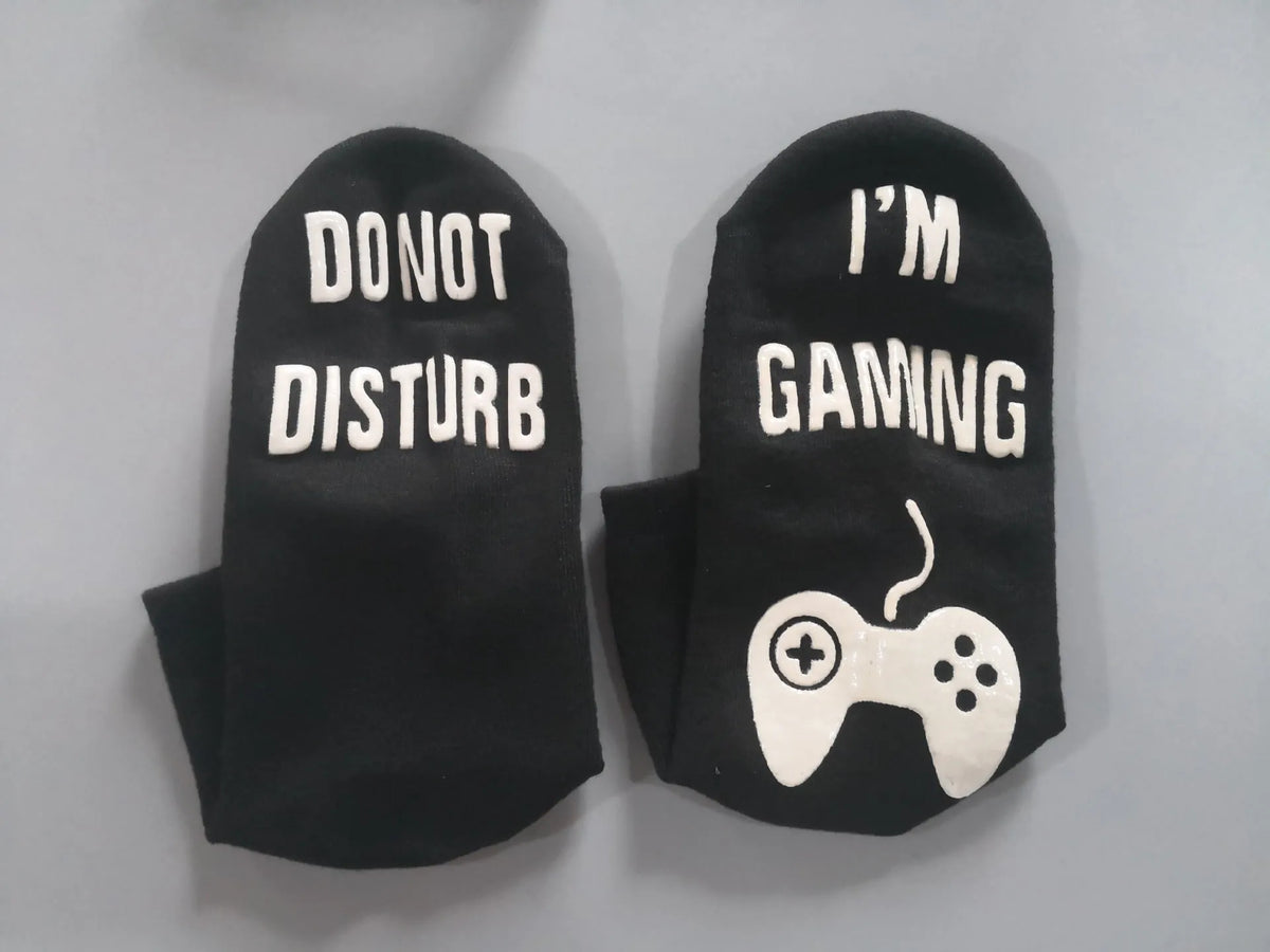 Cotton dispensing socks with 3D letter print, shown in black, blue, and white, with short, medium, and long tube lengths
