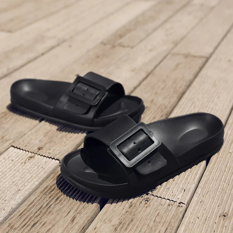 Grey blue women's flip-flop slippers with a single buckle on a soft EVA sole.