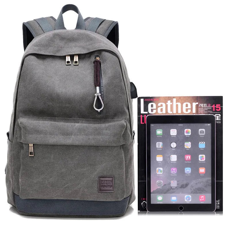 Canvas backpack with USB charging port and multiple compartments including separate laptop pocket