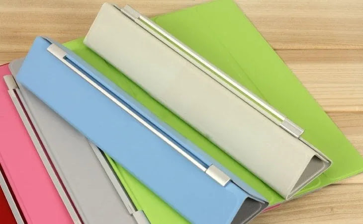 iPad Mini Smart Cover in blue, open to show the folding stand, with textured matte finish and auto sleep/wake feature.